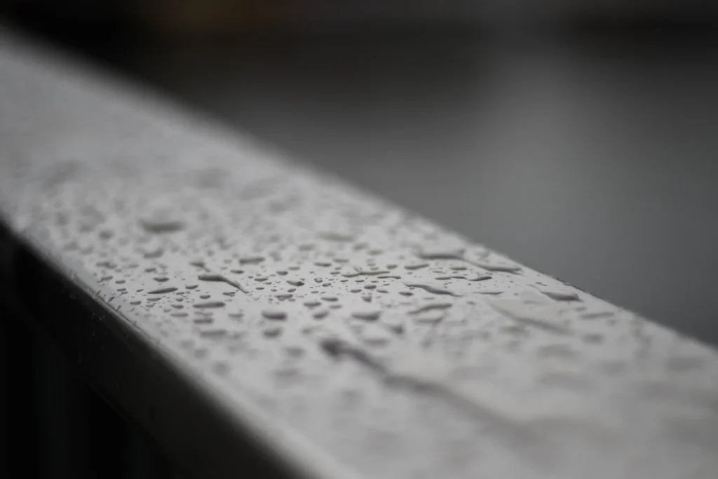 Metal plate with water droplets